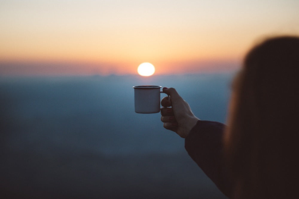 Woman holding cup of coffee